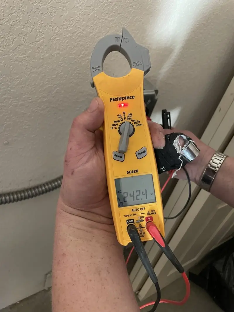Voltage testing with clamp meter during Electrical Installation Services in Palm Harbor